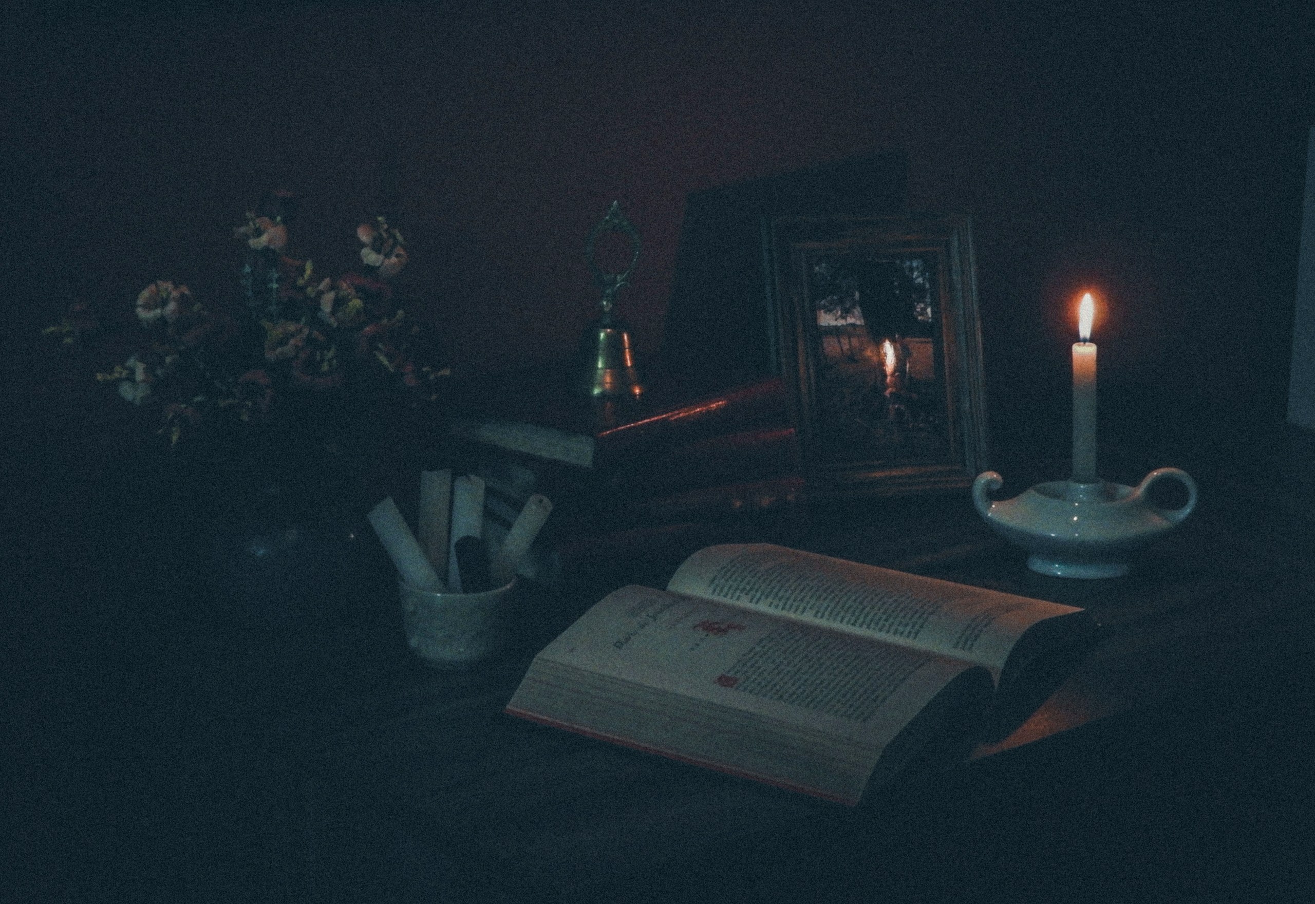 An open book by candlelight